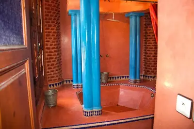 a bathroom with blue columns in a room at Riad-style villa with a private pool in Marrakech