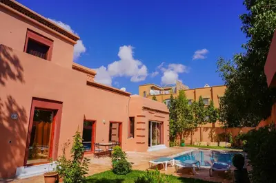 a house with a swimming pool in a yard at Marrakesh Villa 1 in Marrakech