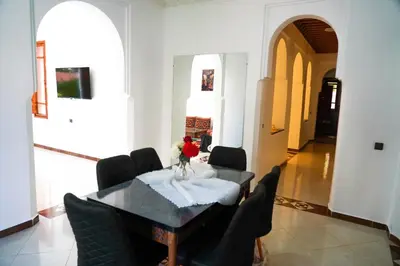 a dining room with a table and chairs at Marrakesh Villa 1 in Marrakech