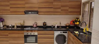a kitchen with a stove and a dishwasher at Dar lala soukaina in Marrakech
