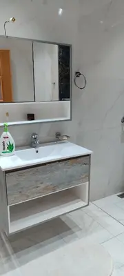 a bathroom with a sink and a mirror at Dar lala soukaina in Marrakech