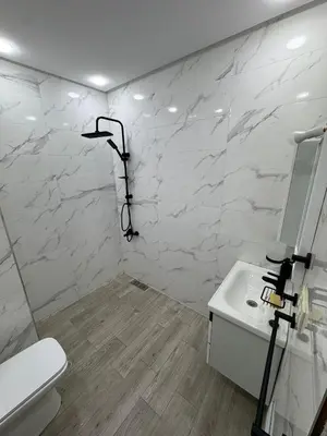 a bathroom with a shower and a toilet and a sink at Apartment in Marrakech in Marrakech