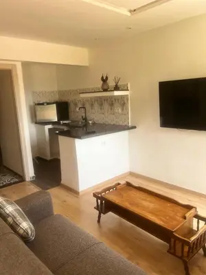 a living room with a ping pong table in it at Studio avec SDB salon tele kitchenette privé dans une villa piscine, calme et commodités in Marrakech