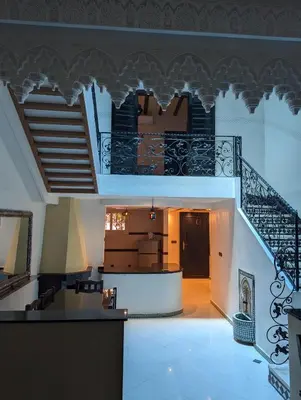 a room with a staircase and a stair case at Riad du village in Marrakech