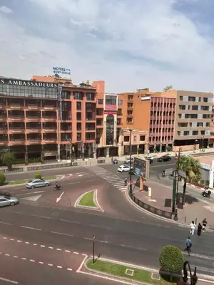 an intersection in a city with cars and buildings at Luxury Gueliz Apartment-Miramas 2 in Marrakech