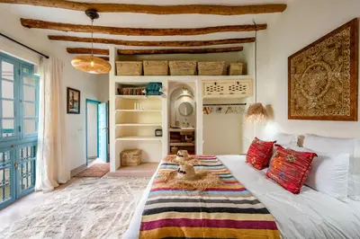 a bedroom with a bed with a blanket on it at Riad Dar Palma Heated Pool Jacuzzi Heart Of Marrakech Medina in Marrakech