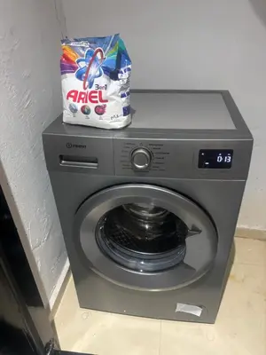 a dryer with a bag of chips on top of it at Chic Duplex Central 3 Suites et Wi-Fi in Marrakech