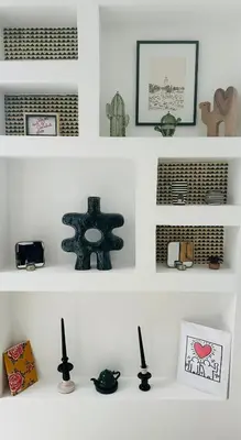 a white shelf with various items on it at Riad Daba Chic in Marrakech