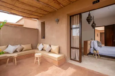 a living room with a couch and a bed at Al destino Resort Marrakech in Marrakech