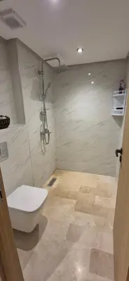 a bathroom with a toilet and a shower at Sérénité en plein Marrakech in Marrakech