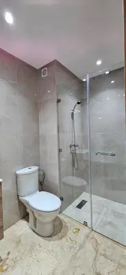 a bathroom with a toilet and a shower at Elegant & Chic Retreat, Pool, Prime Location in Marrakech