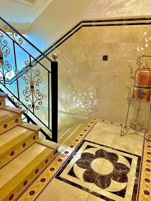 a room with a staircase with a rug on the floor at Marakech home in Marrakech
