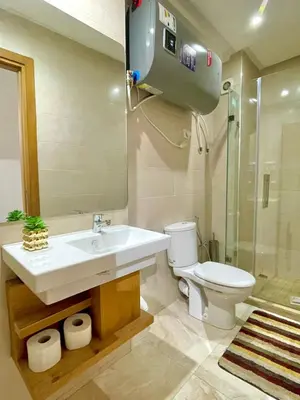 a bathroom with a sink and a toilet and a shower at Opera 160&165 in Marrakech