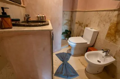 a bathroom with a toilet and a sink at Gueliz family Express in Marrakech
