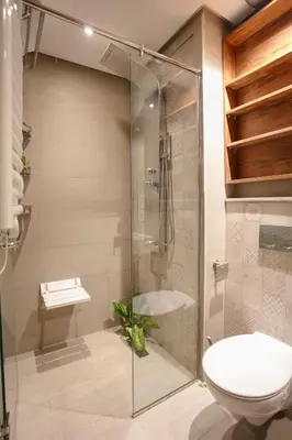a bathroom with a shower and a toilet and a sink at The Modern Luxury - Marrakech in Marrakech