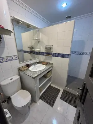 a bathroom with a toilet and a sink and a shower at Maison à la Palmeraie avec piscine et parking à Marrakech in Marrakech