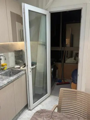 a sliding glass door in a kitchen with a sink at Résidence Soulaymane اقامة سليمان in Marrakech