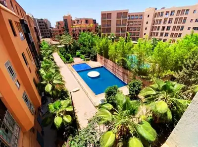 an overhead view of a swimming pool in a city at Beautiful apartment in a very good location and free parking in Marrakech