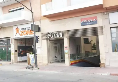 a store on the corner of a city street at Appartement Chic et Lumineux, Proche Gare in Marrakech