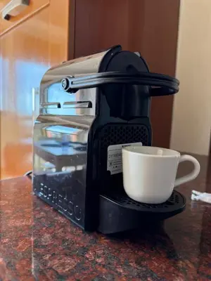a coffee maker with a cup on a counter at Lux apartment With a Sunset View in Marrakech