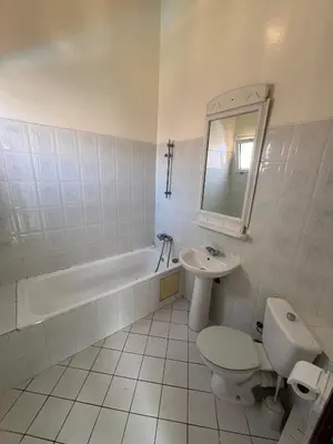 a bathroom with a sink and a toilet and a bath tub at Riad& 4 Chambres Avec La piscine in Marrakech