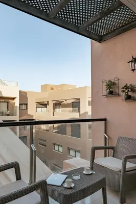 a patio with a table and chairs on a balcony at Premium stay in Guéliz-Hivernage in Marrakech