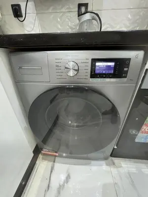 a washing machine is sitting in a room at Feels like home in Marrakech
