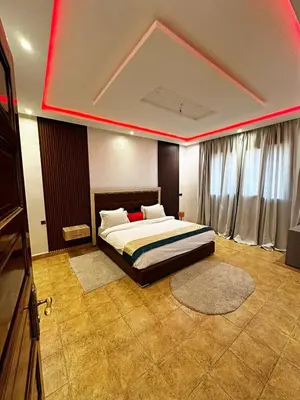 a bedroom with a bed with a red light on it at Marrakech Escape Your Private Villa in Marrakech