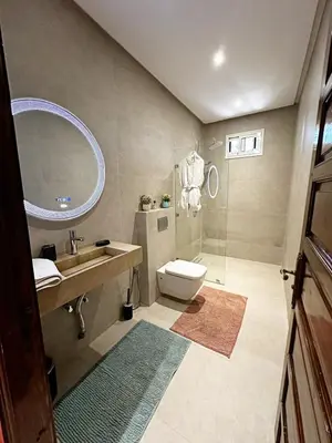 a bathroom with a toilet and a sink and a mirror at Marrakech Escape Your Private Villa in Marrakech