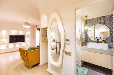 a bathroom with a sink and a mirror in a room at Boho Nest Gueliz Center, Terrace & Quiet in Marrakech