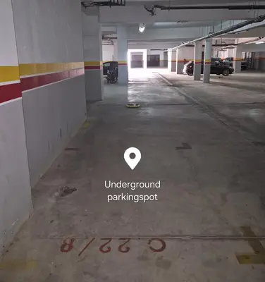 an empty parking lot in a parking garage at Comfortable poolside apartment near city center in Marrakech