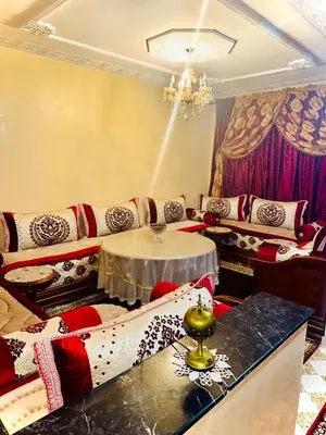a living room with a couch and a table at Marrakech mhamid in Marrakech