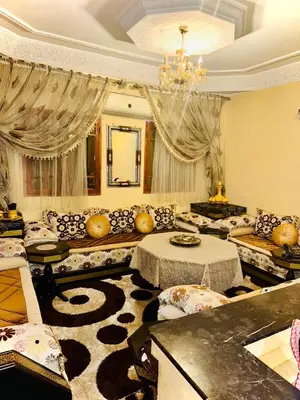 a large living room with couches and a chandelier at Marrakech mhamid in Marrakech