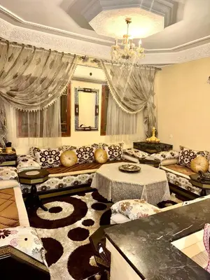 a large living room with couches and a chandelier at Marrakech mhamid in Marrakech