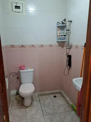 a bathroom with a toilet and a sink at Nour's PLACE in Marrakech