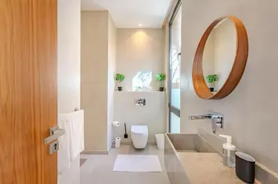 a bathroom with a toilet and a mirror at Villa marrakech in Marrakech