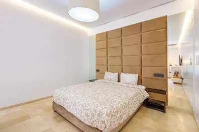 a bedroom with a large bed and a large headboard at Villa marrakech in Marrakech