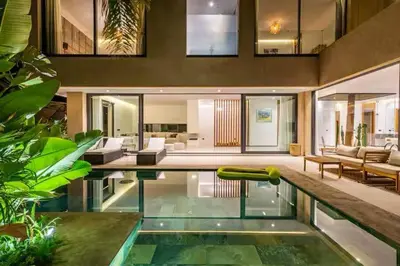 a house with a swimming pool with a living room at Villa marrakech in Marrakech