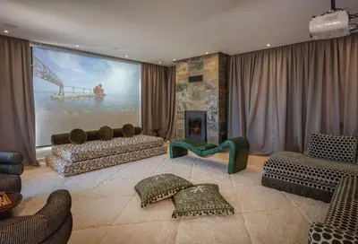a living room with a large painting on the wall at Villa Dar Saliha in Ala el Ma