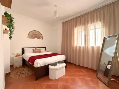 a bedroom with a bed and a window at Le Cosy Nejmaa - Piscine - 4 Prs - Marrakech in Marrakech