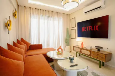a living room with a couch and a tv at Not listed apartement flat in marrakech in Marrakech
