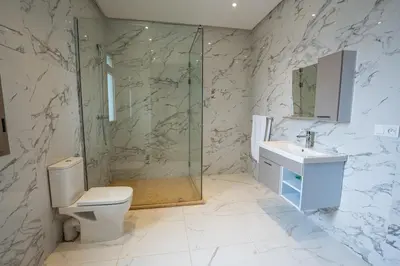 a bathroom with a shower and a toilet and a sink at Petit Palm in El Rhechat