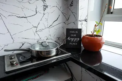 a pot sitting on top of a stove in a kitchen at Marjane Allal Fassi 2 chambres Bedrooms 2 Bathrooms Wi-Fi fibre climatisation in Marrakech