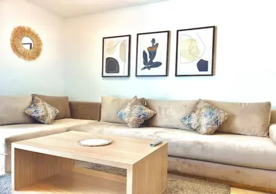 a living room with a couch and a coffee table at havre de paix in Marrakech