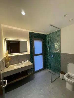 a bathroom with a toilet and a sink and a shower at Imagine Villa in Marrakech