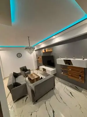 a living room with a couch and a table at Appartement moderne in Marrakech