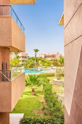 a view of the pool from a building at Spacious luxury 3BR by the pool in Marrakech