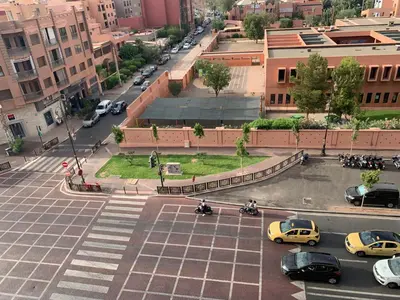 an aerial view of a city street with cars at Appartement Marrakechi in Marrakech