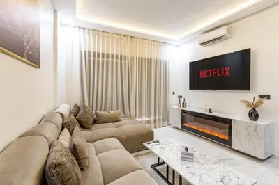 a living room with a couch and a tv at Cocoon in Gueliz, Netflix, IPTV in Marrakech