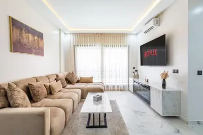 a living room with a couch and a tv at Cocoon in Gueliz, Netflix, IPTV in Marrakech